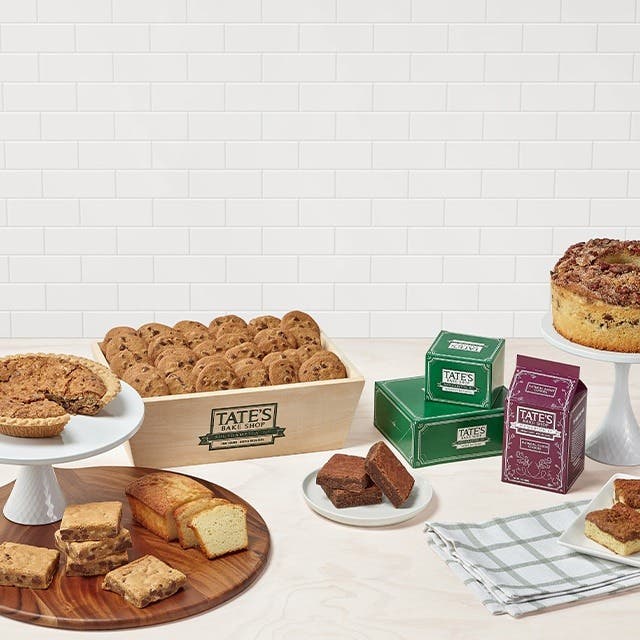 Various baked goods and bags of cookies on a table